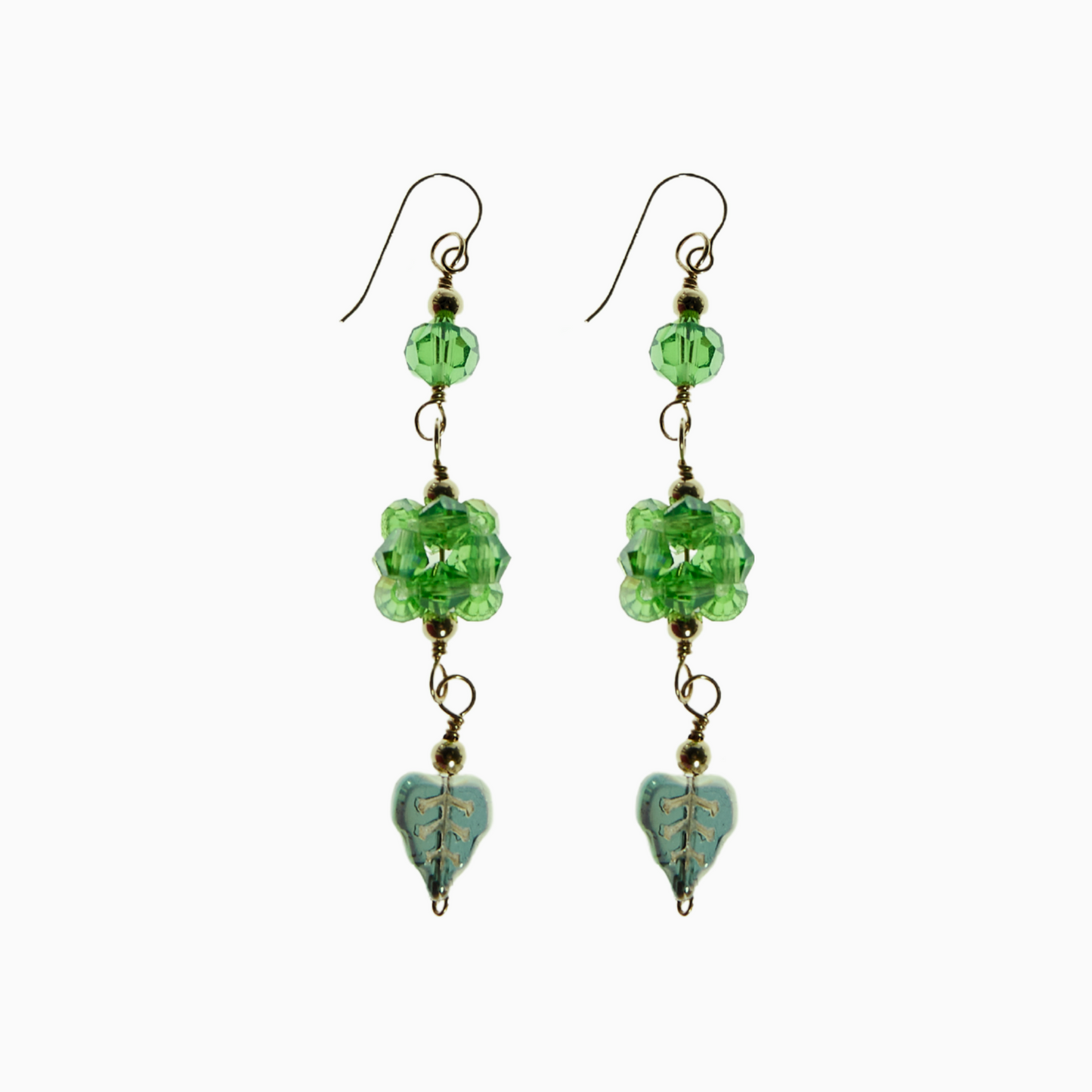 August Green Peridot Earrings featuring bold peridot-inspired crystals, hand-sewn with 4mm bicone crystals, sparkling 6mm bicone beads, and a cute leaf charm π. Hanging from 14k gold-filled hooks, these earrings symbolise growth, strength, and healing.