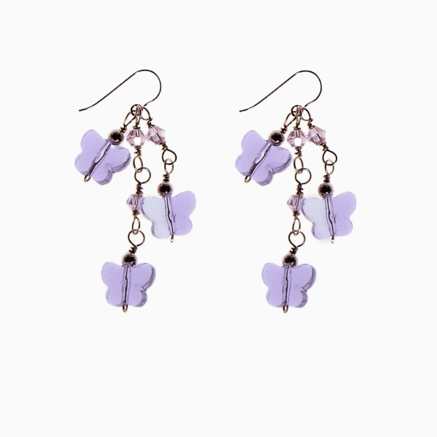 Purple earrings feature a stunning cascade of 10mm butterfly glass crystals, 3mm bicone glass crystals, and delicate 3mm 14k gold-filled spacer balls, all gracefully hanging from a secure earring hook.