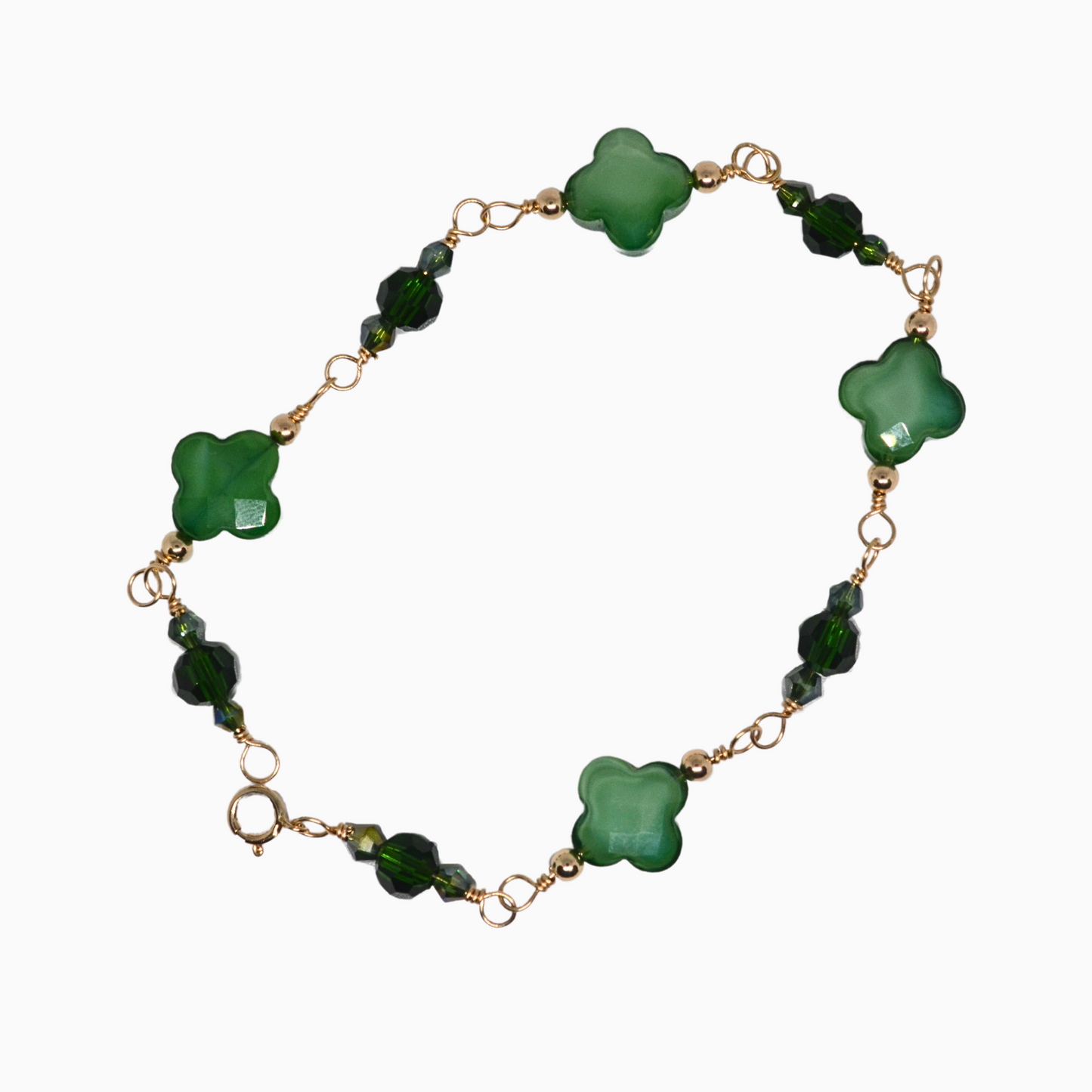 This beautiful, handmade bracelet is adorned with emerald inspired green crystal clovers, symbolizing luck and good fortune. Crafted with 14k gold-filled wire, it’s the perfect accessory for any outfit.