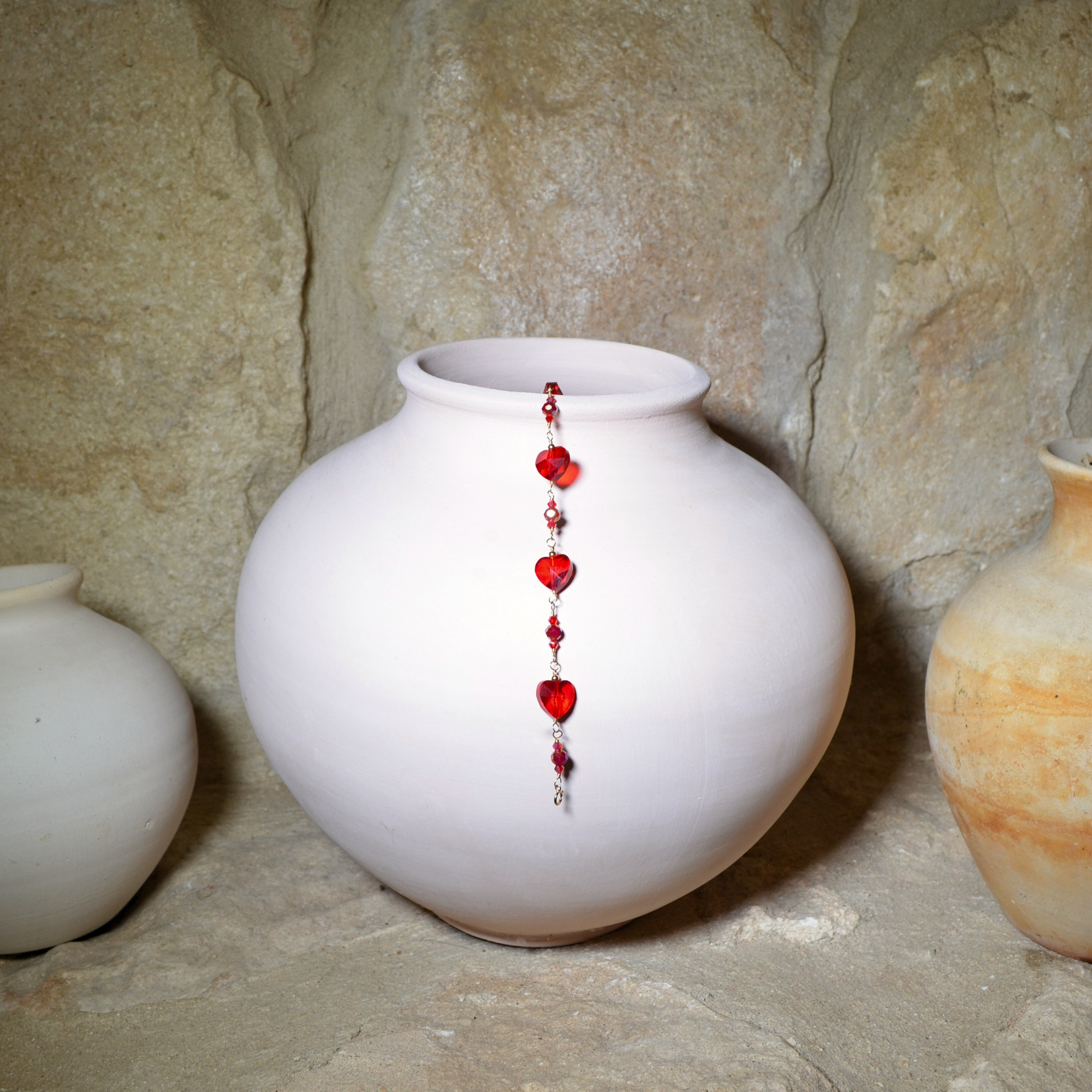 Handmade red heart crystal bracelet on a gold-filled chain displayed beautifully in a white vase. Perfect for birthday gift, valentines gift, anniversary gift or for any occasion. 