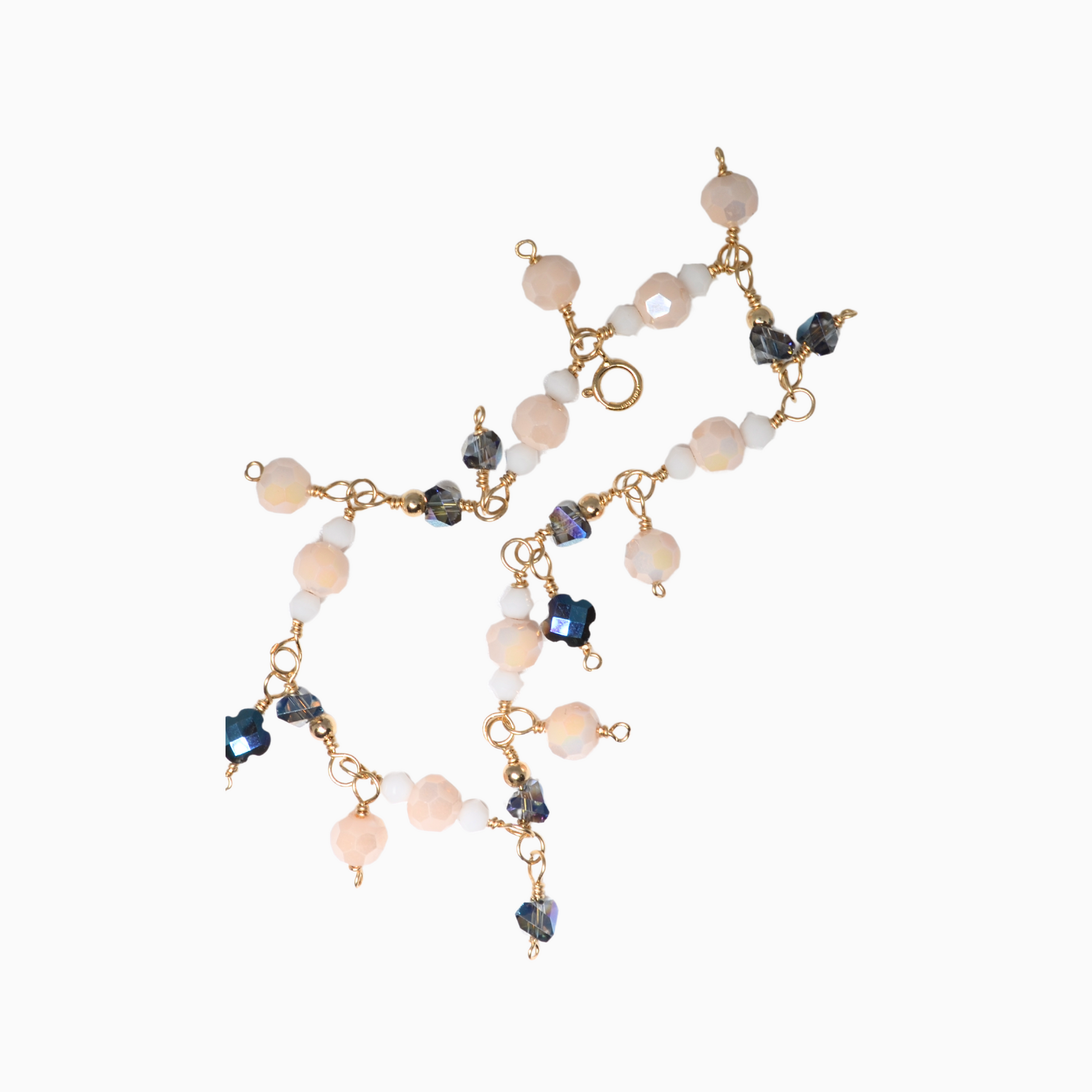 This enchanting, handmade bracelet is inspired by the birthstones of June: pearl, moonstone, and alexandrite. Featuring a stunning combination of iridescent glass crystals, this elegant piece is perfect for any occasion. Crafted with 14k gold-filled wire, it's both beautiful and durable.